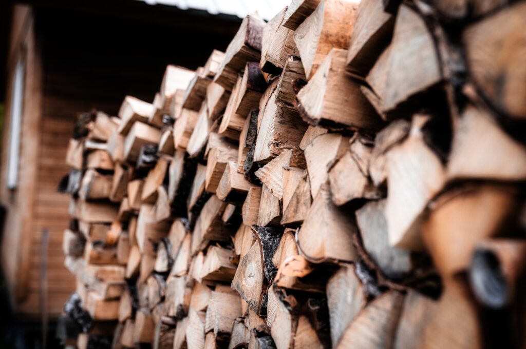 Neatly stacked bundles of campground firewood wrapped and ready for sale